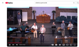 Front of the sanctuary during contemporary service with pastor and musicians on YouTube